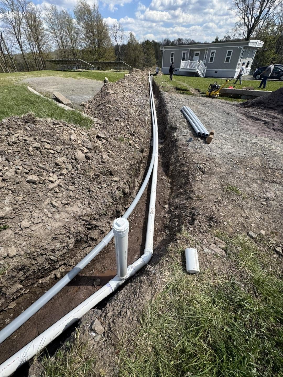 Long septic pipe run in an open trench