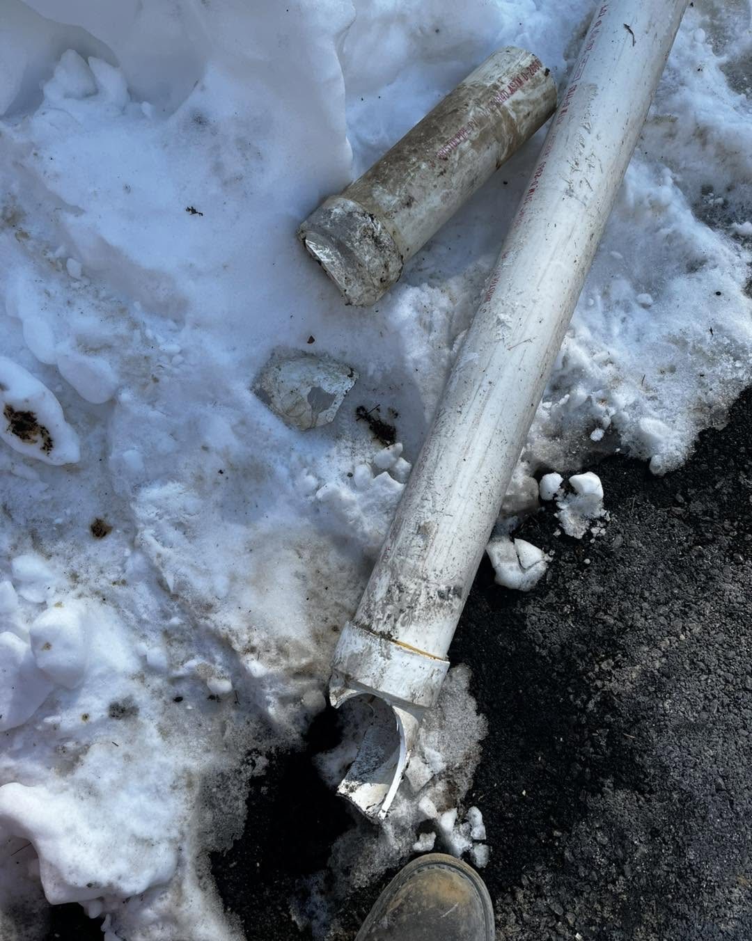 Broken septic pipe in snow