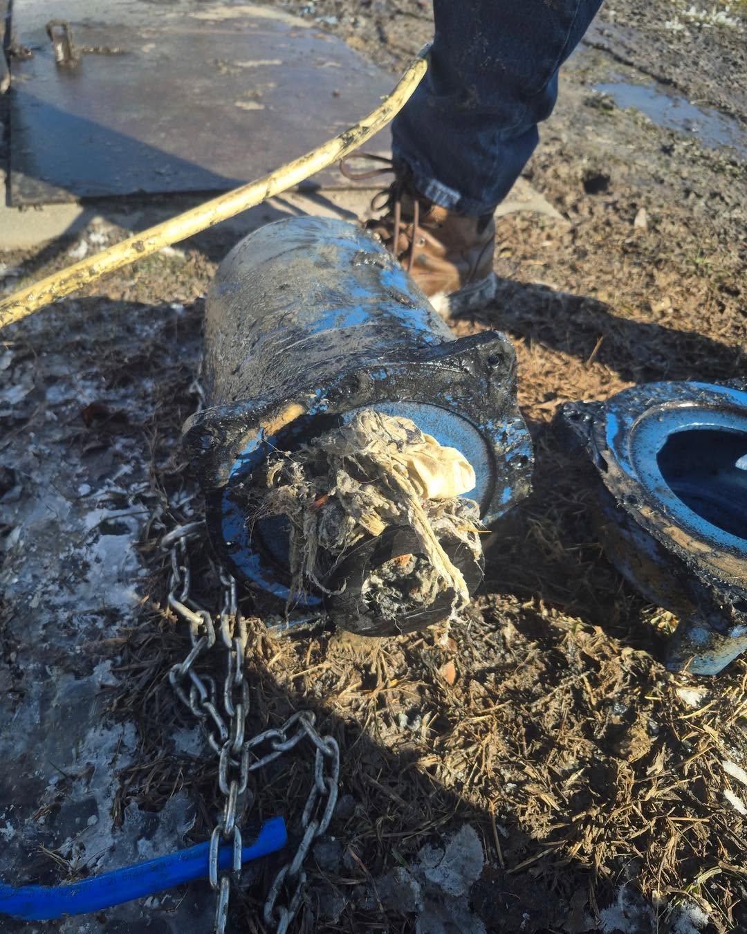 Clogged septic component removed for repair