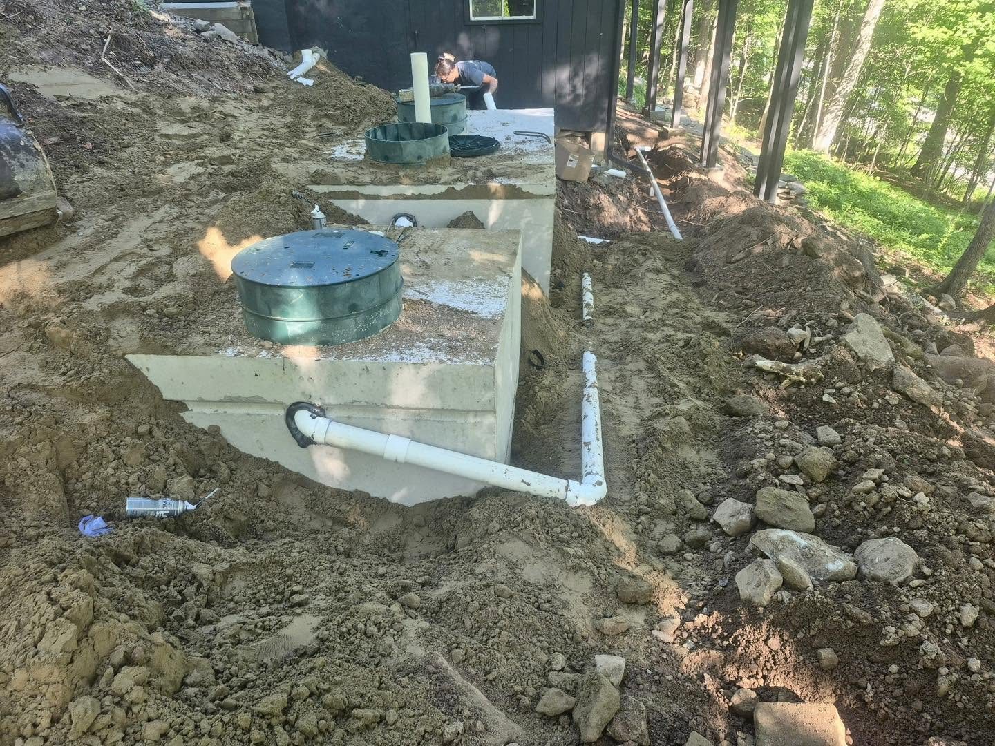 Septic tanks and piping on a hillside